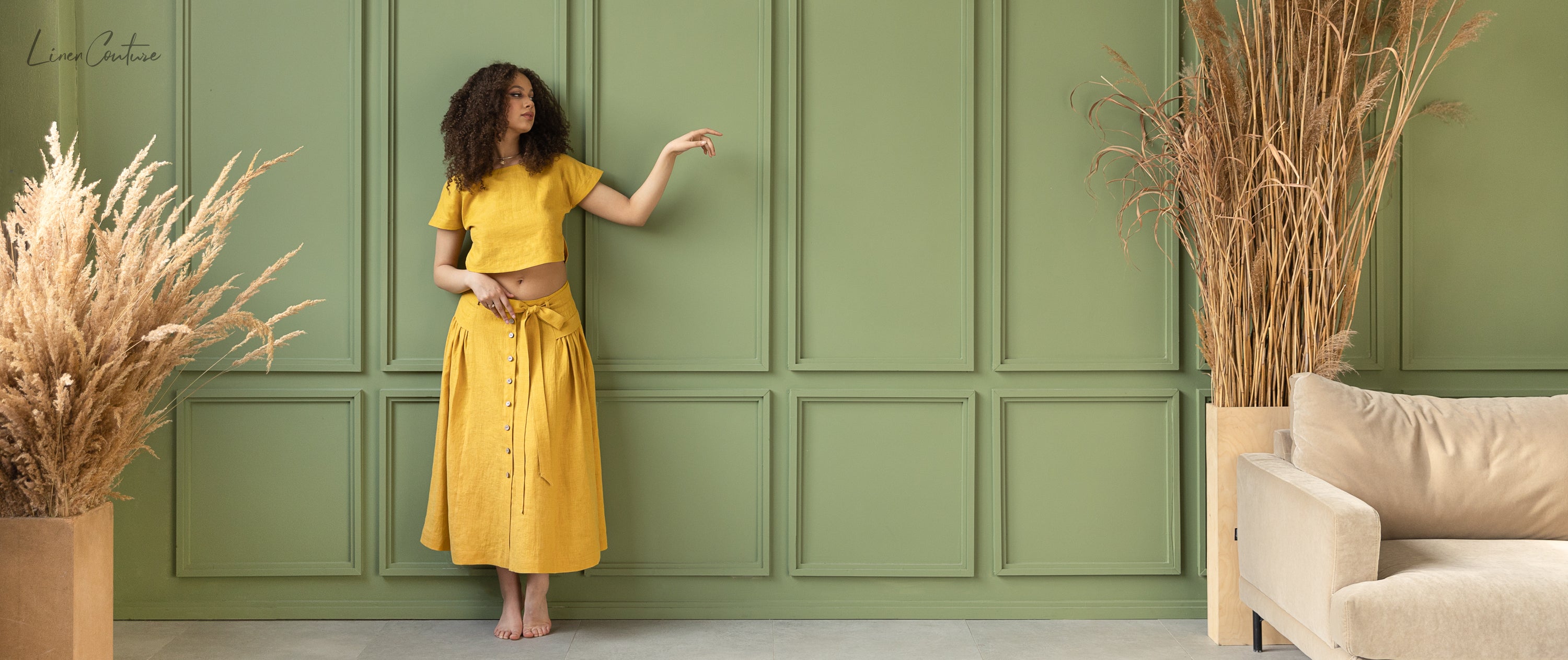 Taormina Honey Linen Crop Top and Midi Skirt Set displayed on a model, showcasing its elegant design and earthy beige color.