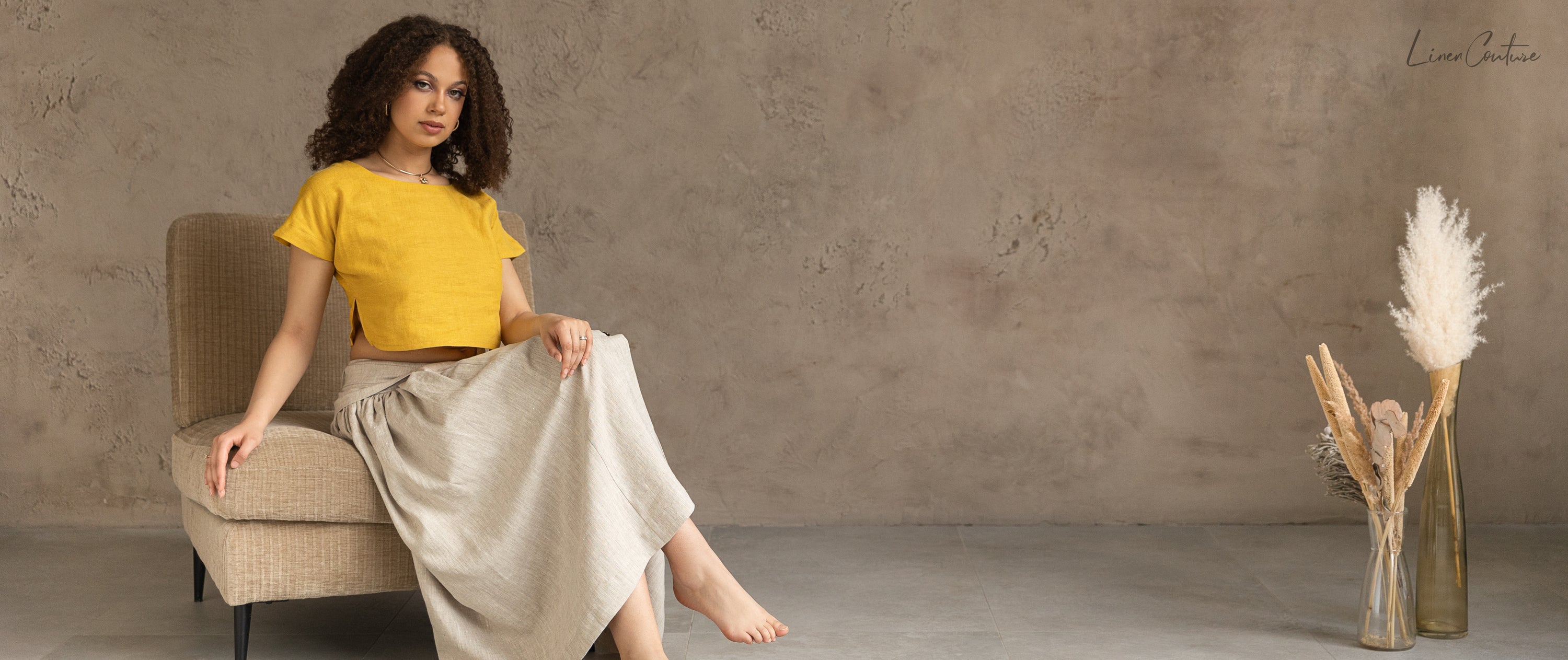 Taormina Honey Linen Crop Top and Midi Skirt Set displayed on a model, showcasing its elegant design and earthy beige color.