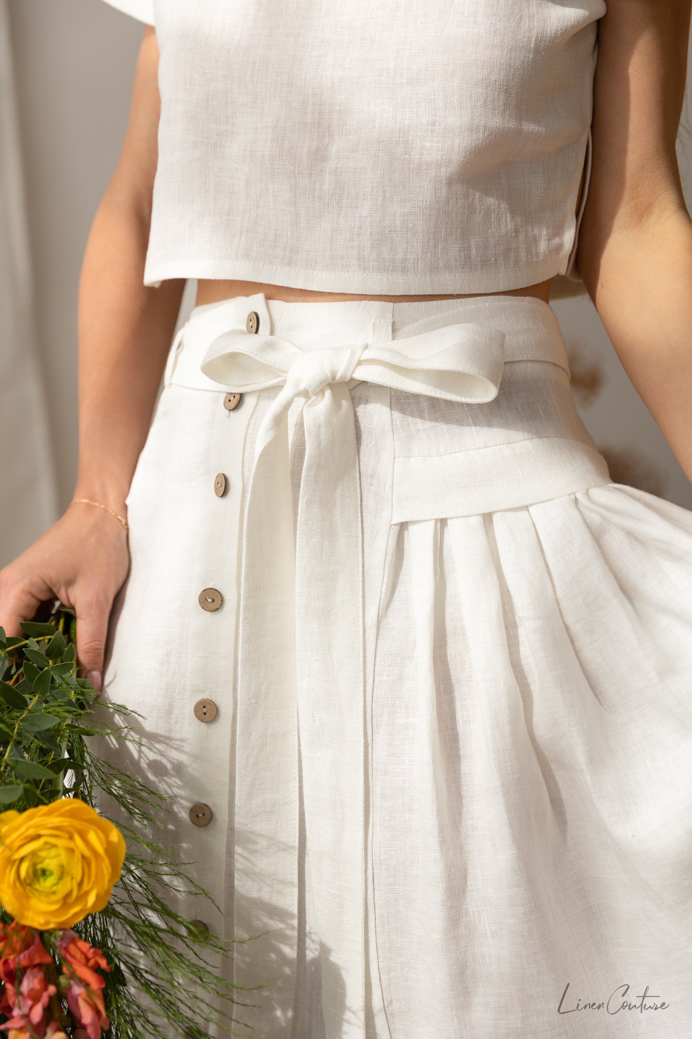 Taormina Linen Crop Top and Midi Skirt Set in earthy beige, showcasing its elegant design and breathable fabric.