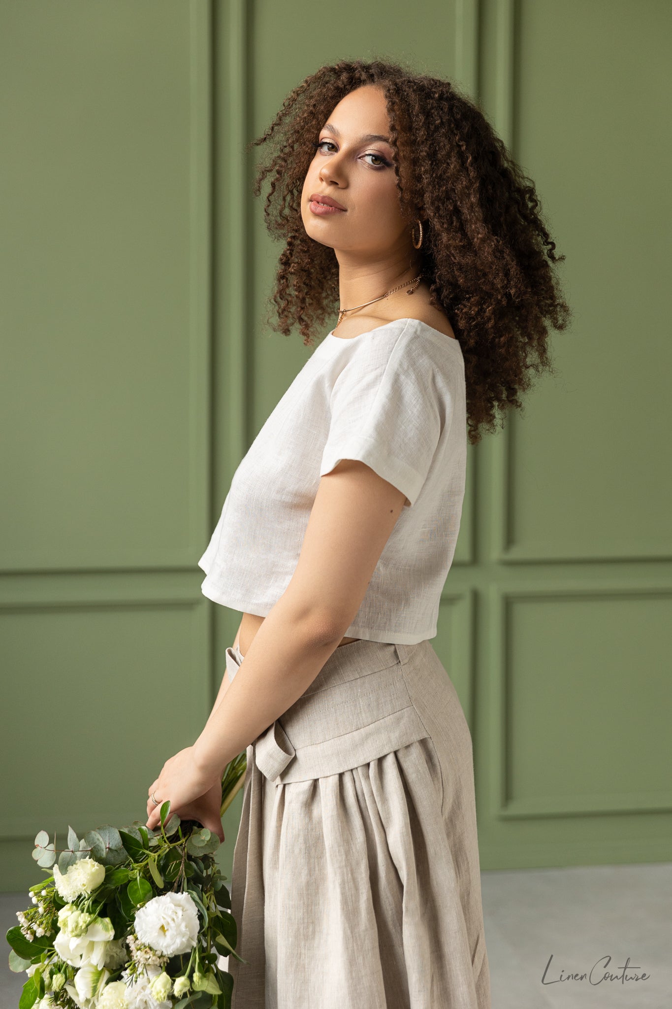 Taormina Pale Pink Linen Crop Top and Midi Skirt Co Ord Set displayed on a model, showcasing its elegant design and breathable fabric.