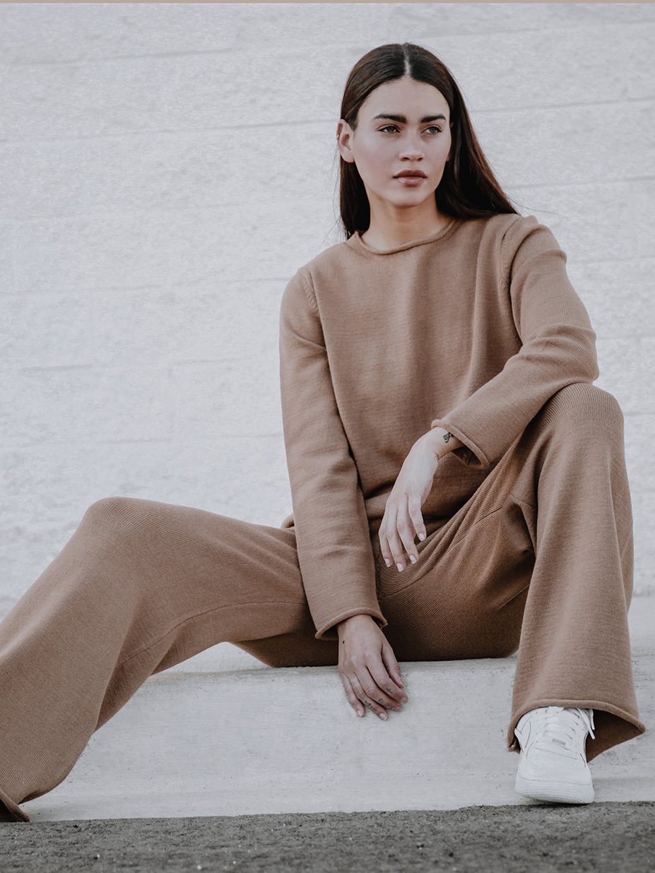 Tarlo Cashmere Pants featuring a high-rise ribbed waistband and wide leg silhouette, made from a soft cashmere wool blend.