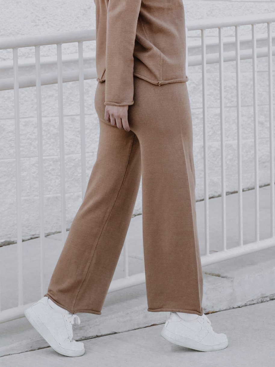 Tarlo Cashmere Pants featuring a high-rise ribbed waistband and wide leg silhouette, made from a soft cashmere wool blend.