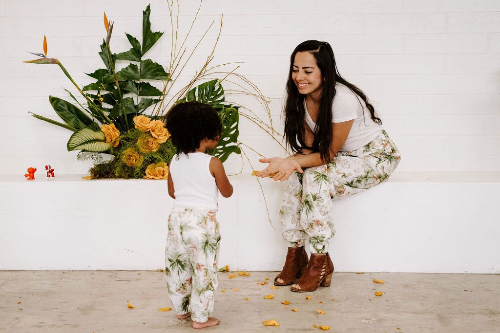 A pair of Ashley Rose Adult Joggers in vibrant flamingo color, featuring an elastic waistband and pockets for convenience.