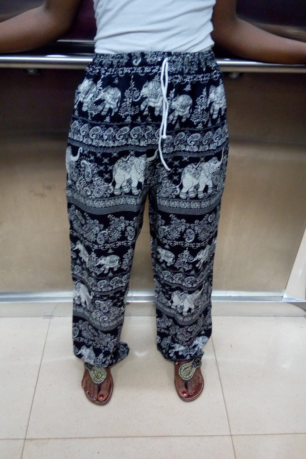 Stylish animal print rayon black pants and capris with elasticated waistband and ankles, perfect for yoga and casual wear.