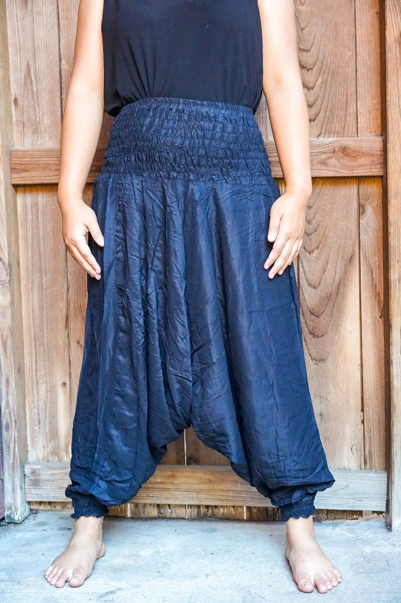 A pair of Baggy Festival Hippie Harem Pants in soft rayon fabric, featuring a drop crotch design and elasticated waist, perfect for casual and festival wear.