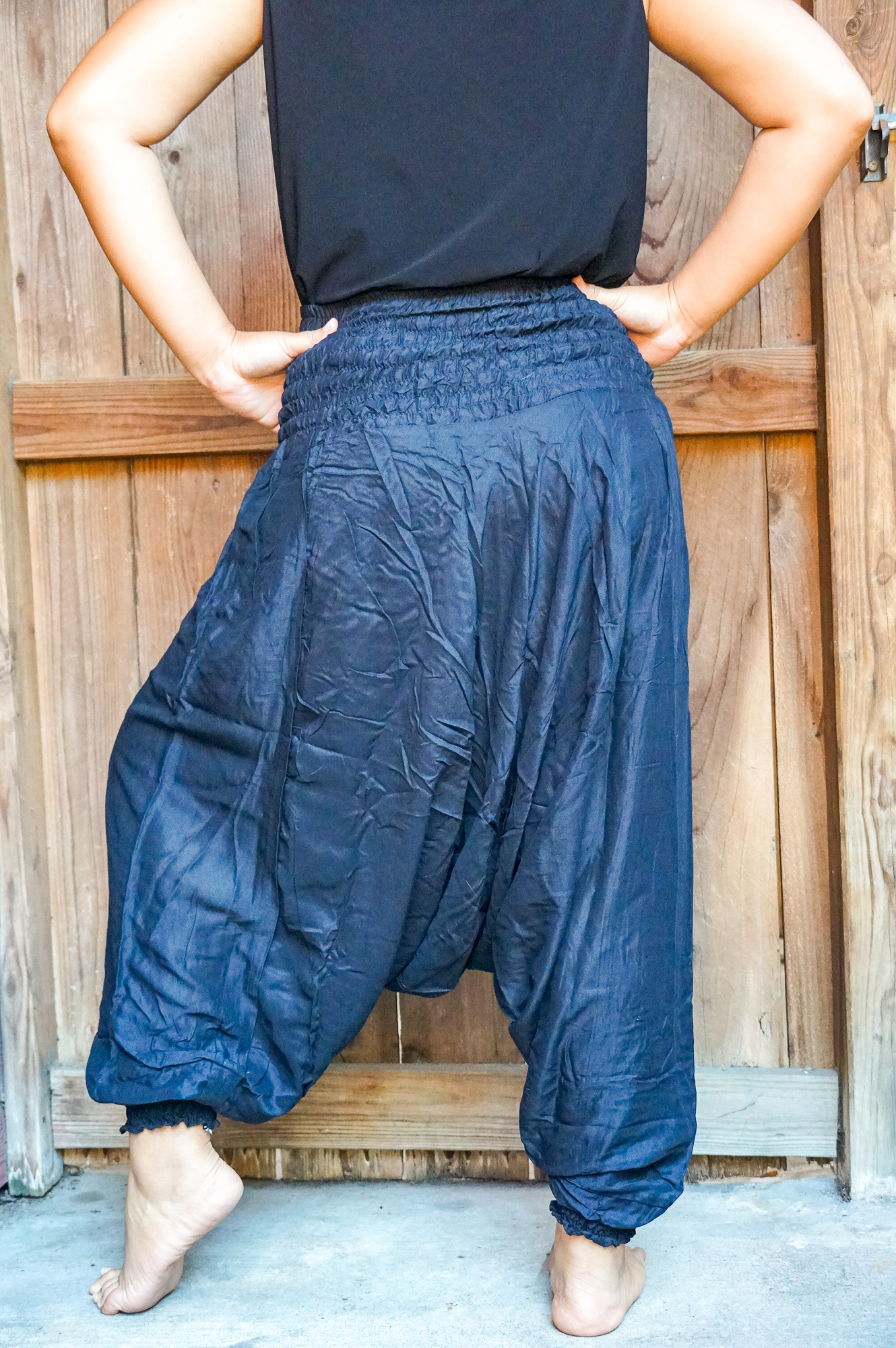 A pair of Baggy Festival Hippie Harem Pants in soft rayon fabric, featuring a drop crotch design and elasticated waist, perfect for casual and festival wear.