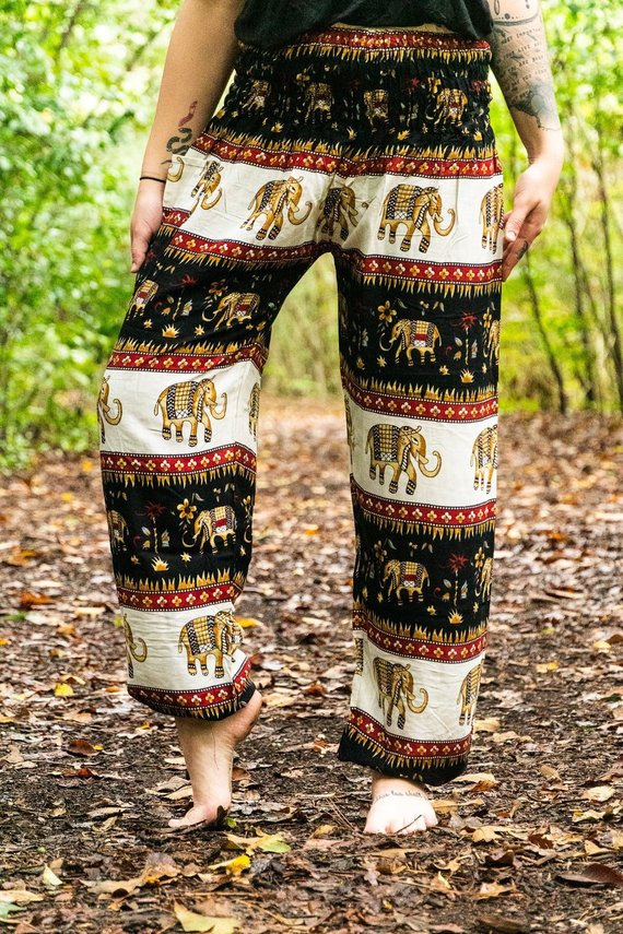 Black Elephant Harem Pants for women, featuring a bohemian design, elastic waist, and ankle cuffs, made from lightweight breathable rayon fabric.