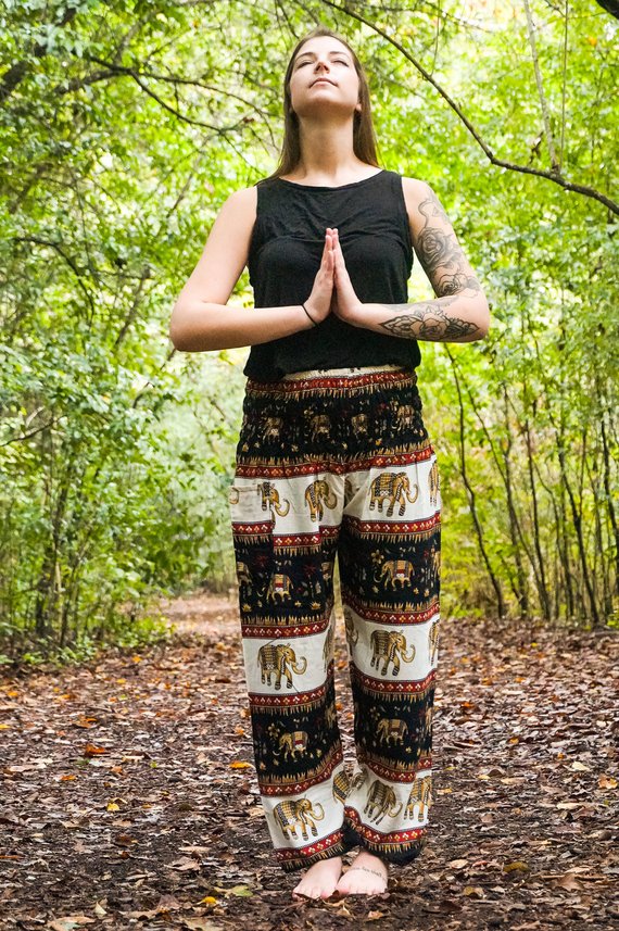 Black Elephant Harem Pants for women, featuring a bohemian design, elastic waist, and ankle cuffs, made from lightweight breathable rayon fabric.