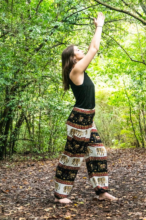 Black Elephant Harem Pants for women, featuring a bohemian design, elastic waist, and ankle cuffs, made from lightweight breathable rayon fabric.