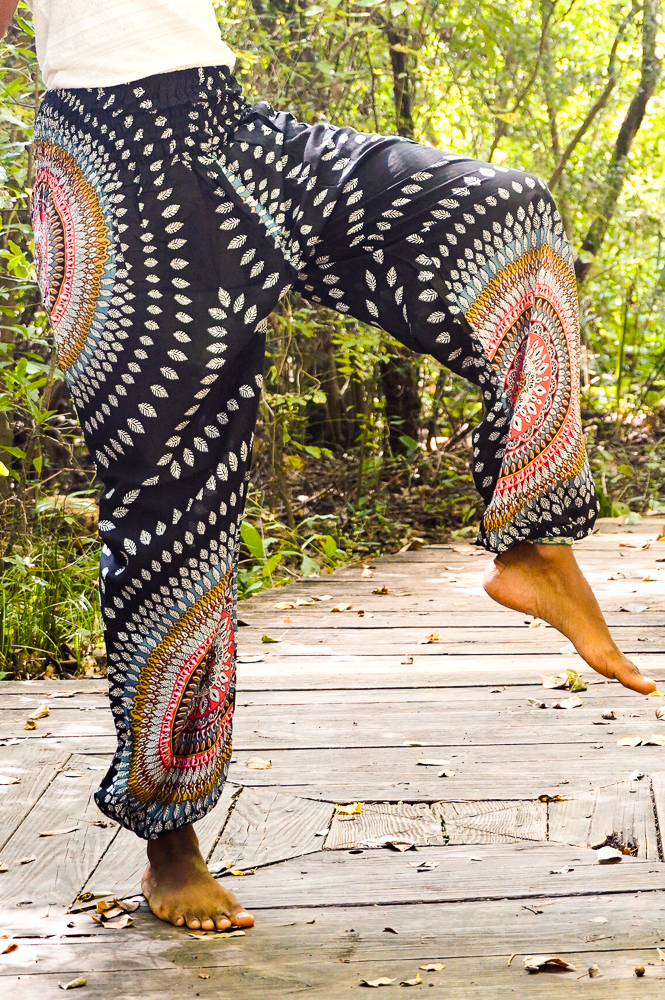 Black Lotus Women Harem Pants in vibrant patterns, made from 100% rayon, featuring an elastic waist and ankle, with a side pocket for convenience.