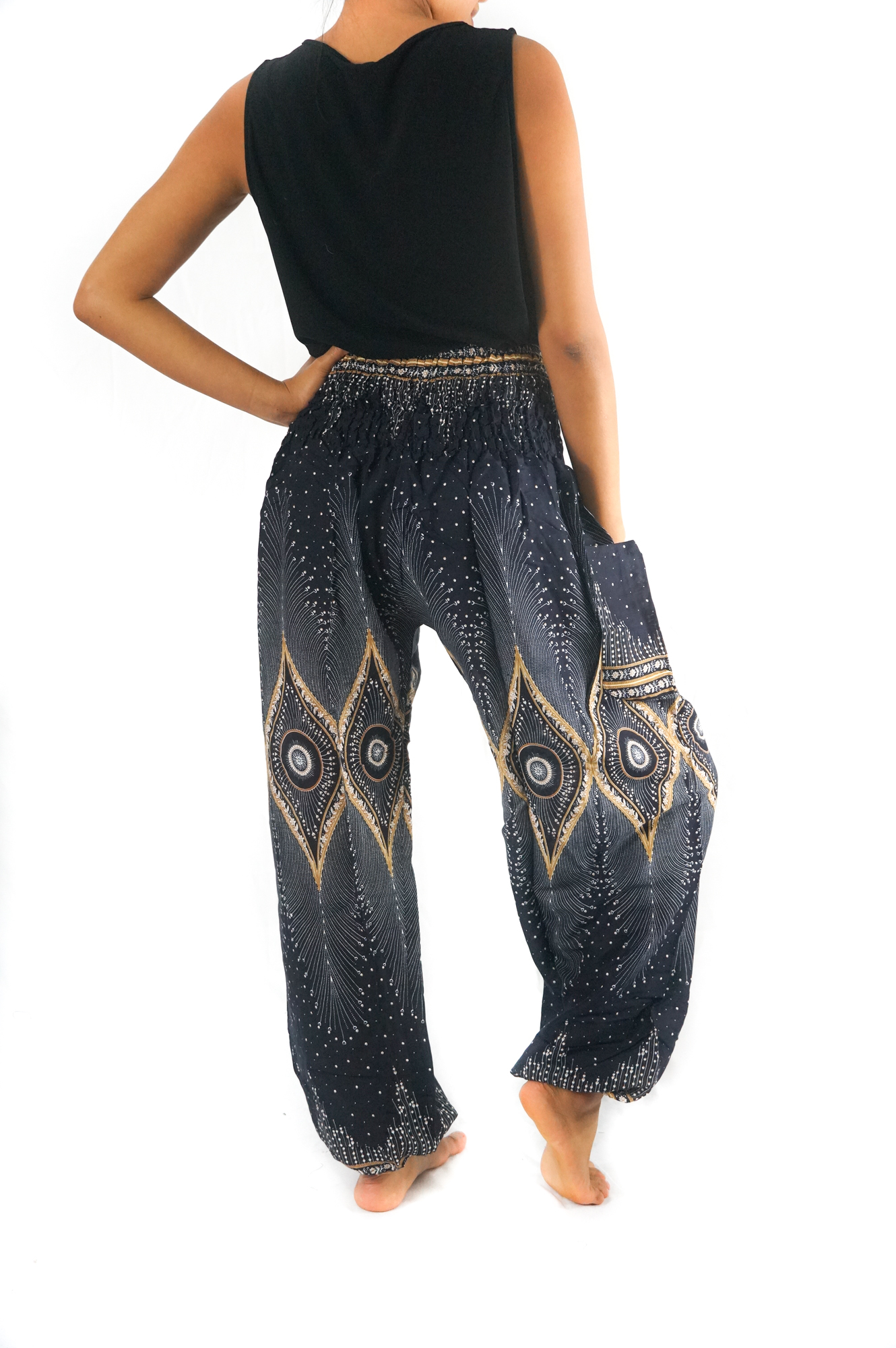 Black PEACOCK Women Boho Pants featuring a flowy design, elastic waist, and ankle, made from 100% breathable rayon fabric, perfect for yoga and casual wear.