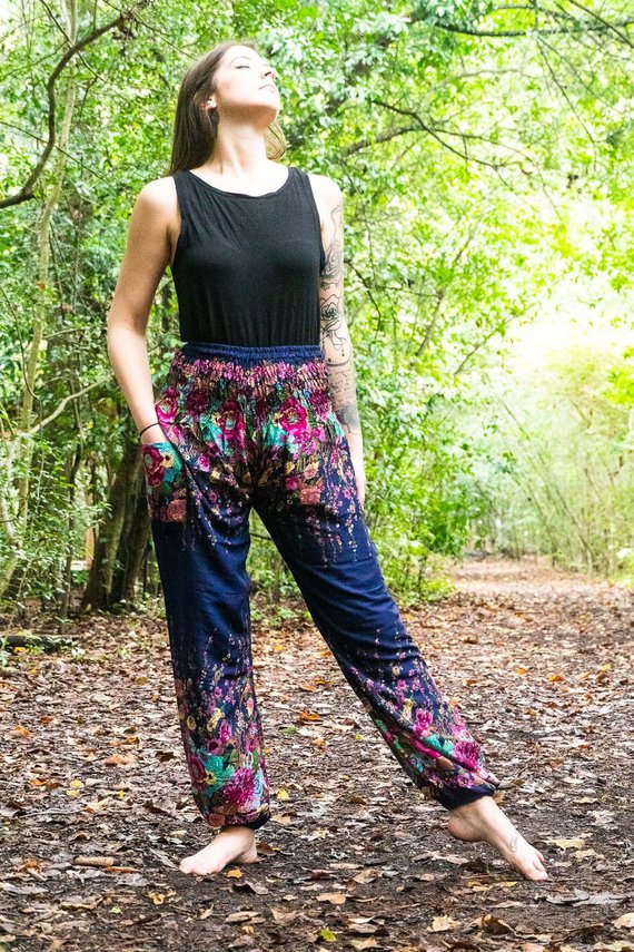 Blue floral women harem pants made of 100% rayon, featuring an elastic waist and ankle, one side pocket, and a loose, comfortable fit.