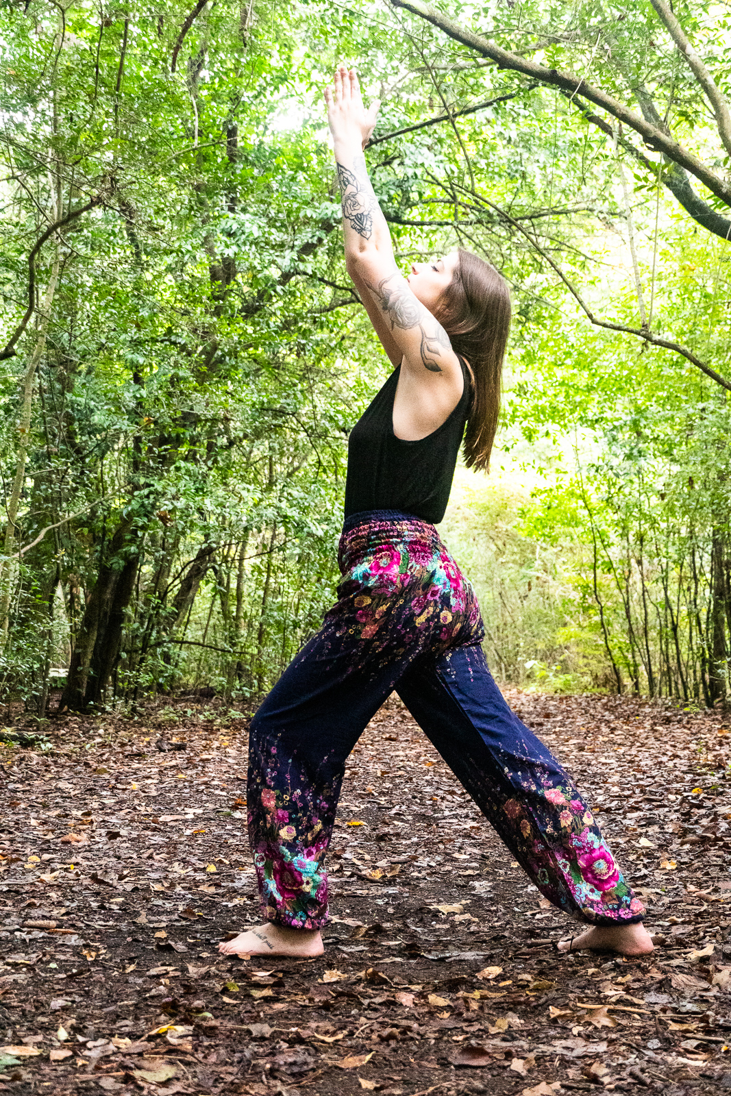 Blue floral women harem pants made of 100% rayon, featuring an elastic waist and ankle, one side pocket, and a loose, comfortable fit.