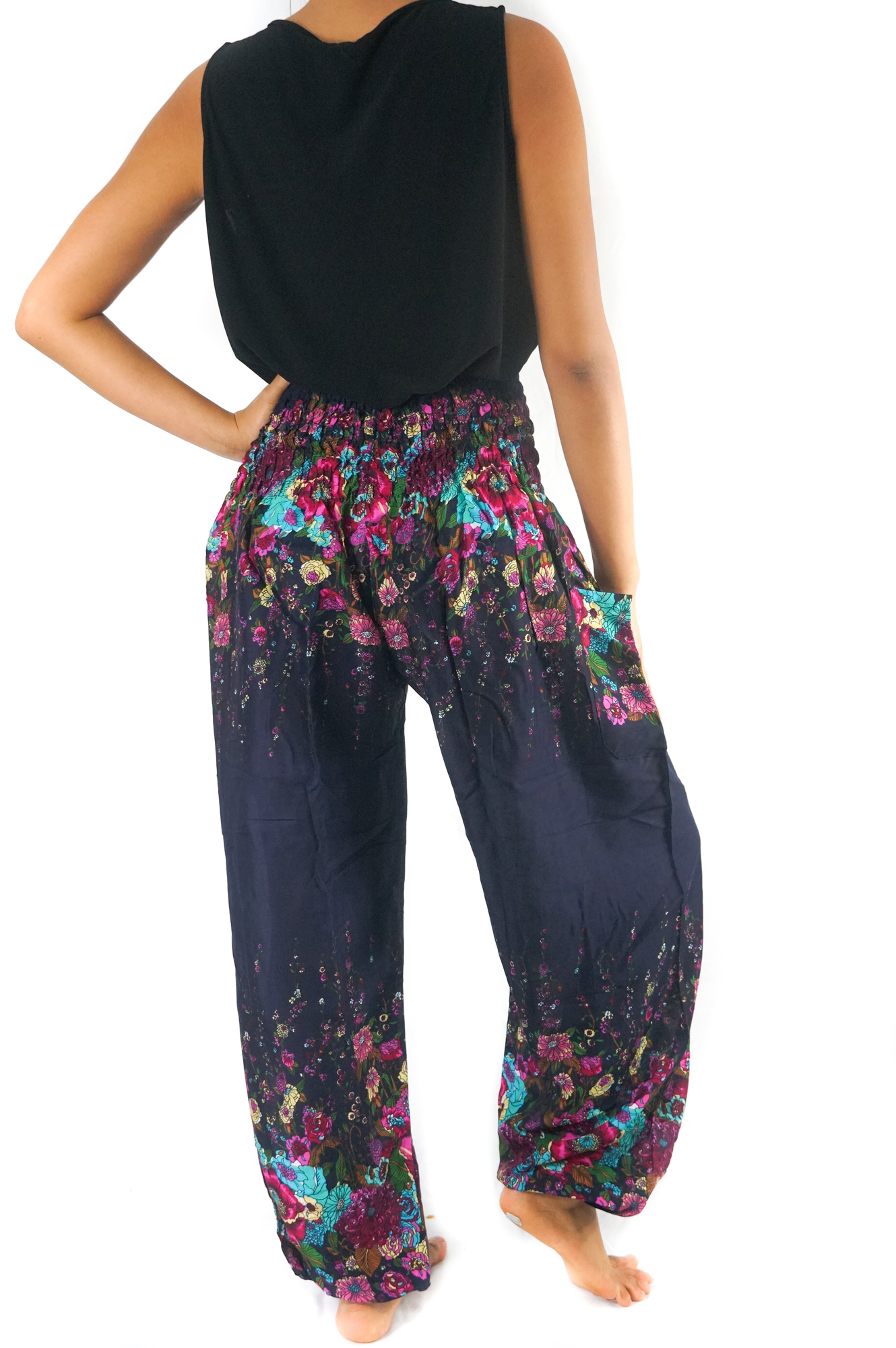 Blue floral women harem pants made of 100% rayon, featuring an elastic waist and ankle, one side pocket, and a loose, comfortable fit.