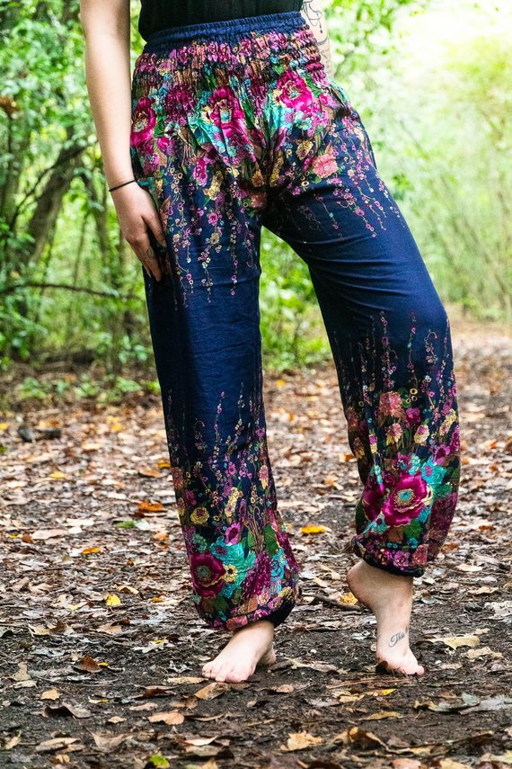 Blue floral women harem pants made of 100% rayon, featuring an elastic waist and ankle, one side pocket, and a loose, comfortable fit.