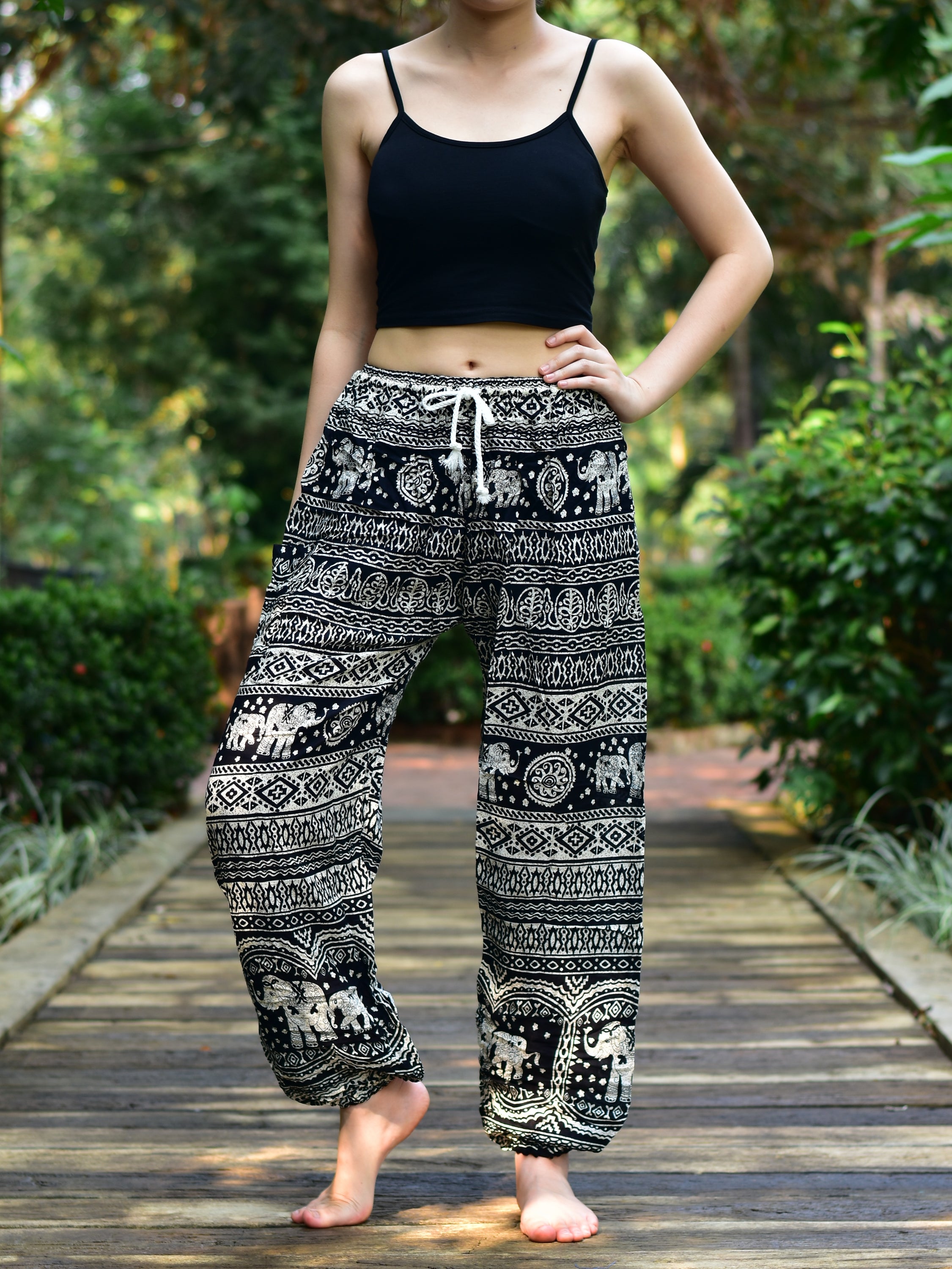 Bohotusk Black Elephant Calf Print Women's Harem Pants featuring a tie waist and elasticated ankles, perfect for casual and active wear.