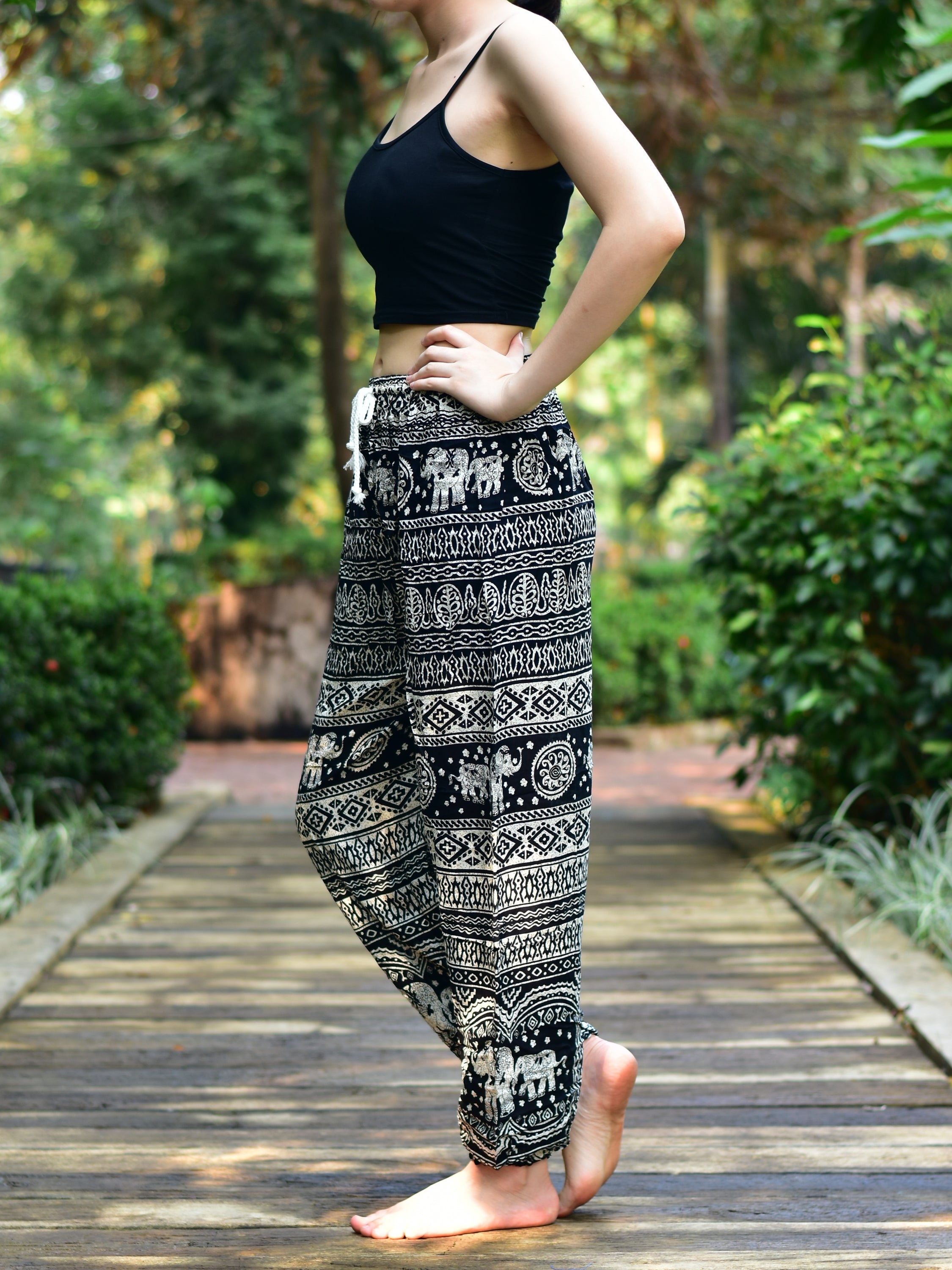 Bohotusk Black Elephant Calf Print Women's Harem Pants featuring a tie waist and elasticated ankles, perfect for casual and active wear.