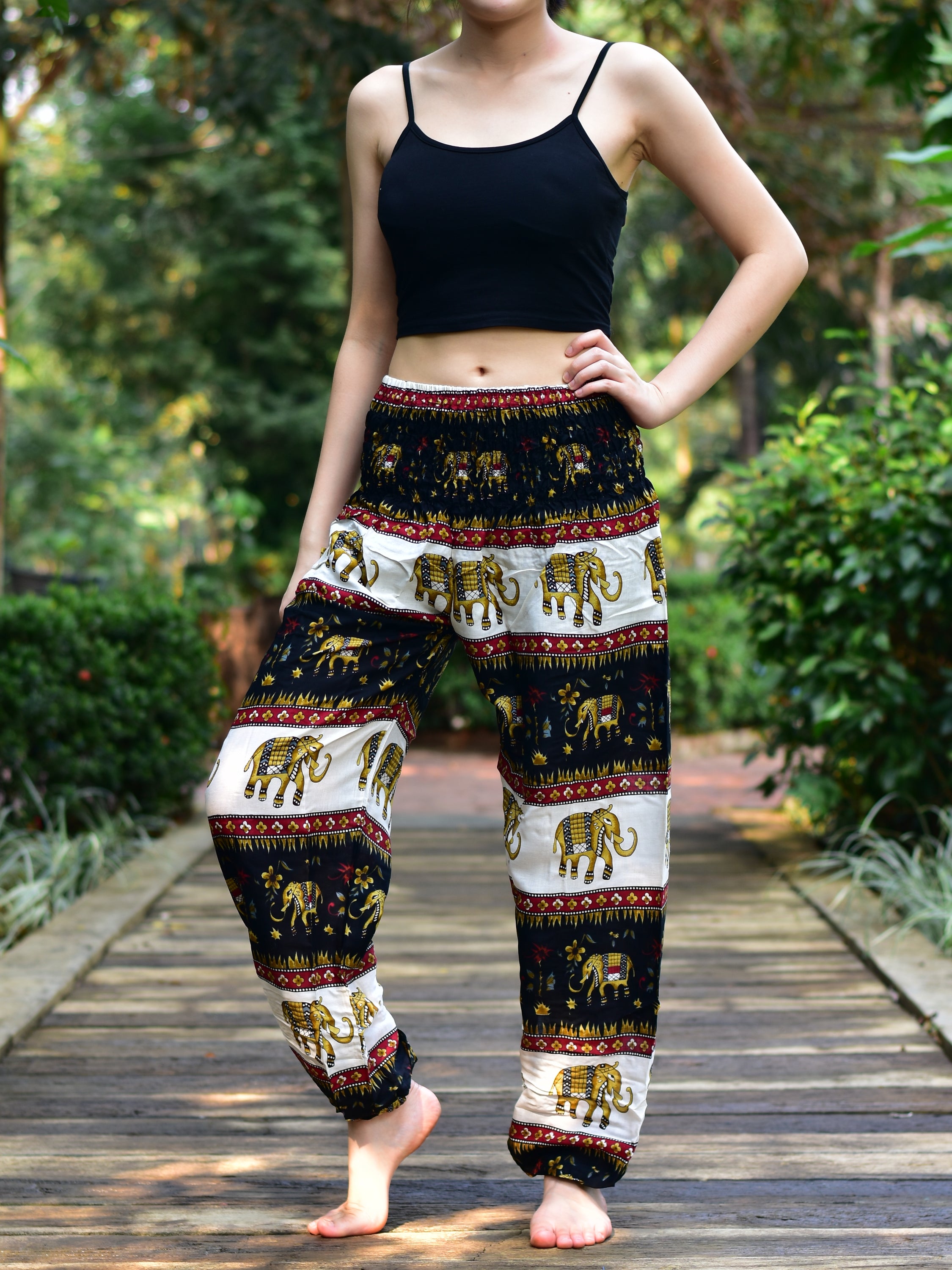 Bohotusk Black Elephant Stripes Print Women's Trousers with elasticated smocked waist and external pocket, showcasing a stylish and comfortable design.