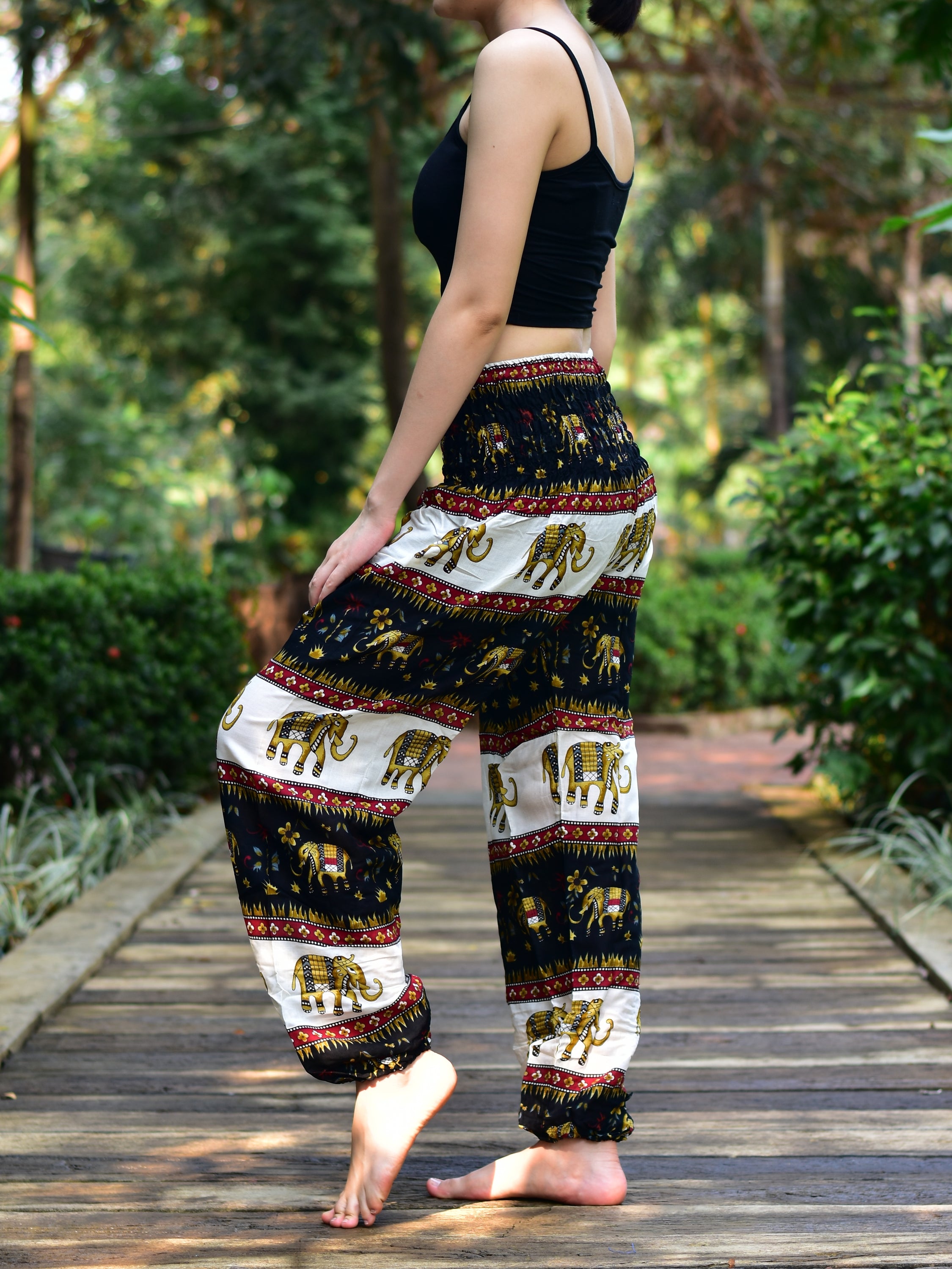 Bohotusk Black Elephant Stripes Print Women's Trousers with elasticated smocked waist and external pocket, showcasing a stylish and comfortable design.