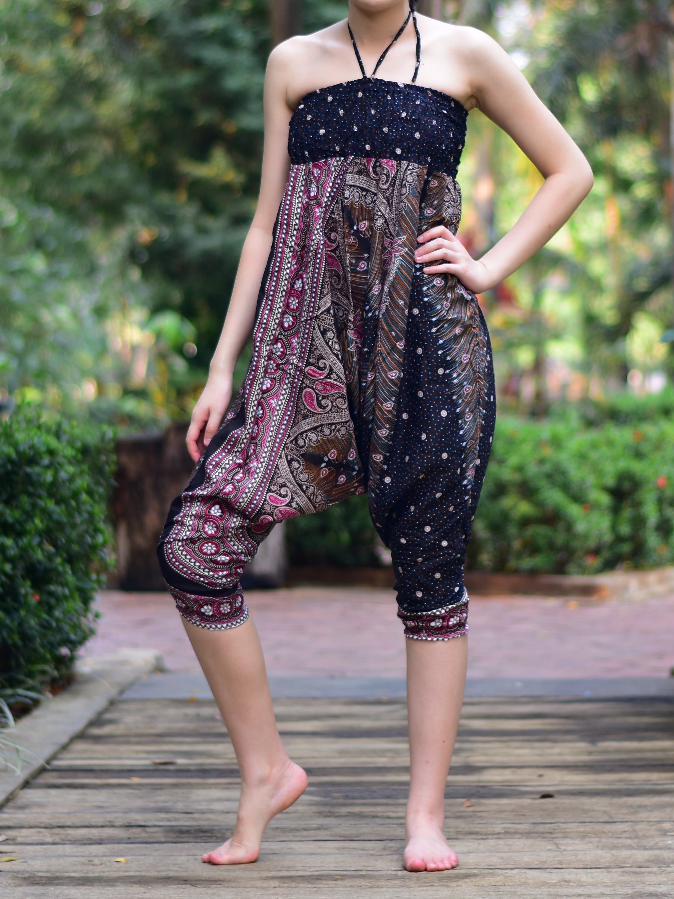 Bohotusk Black Peacock Print Jumpsuit showcasing its elegant design and vibrant colors, perfect for versatile styling.