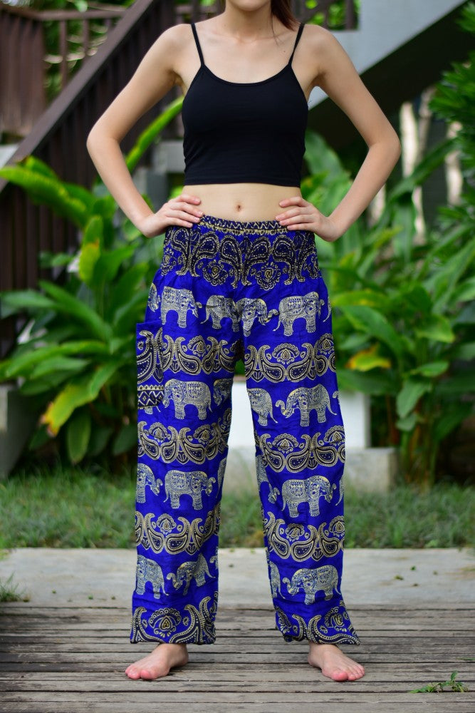 Bohotusk Blue Elephant Grassland Print trousers featuring an elasticated smocked waist, showcasing vibrant colors and a stylish design.