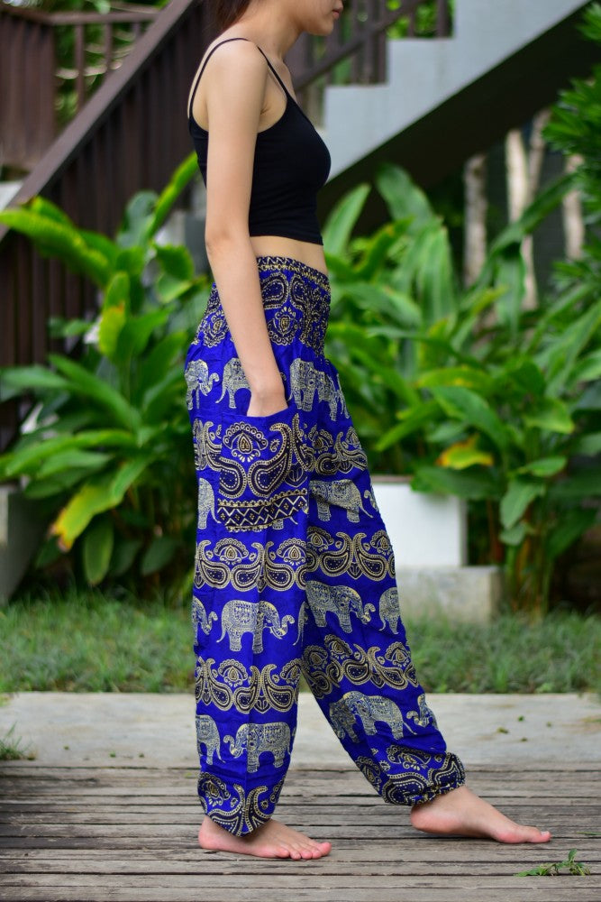 Bohotusk Blue Elephant Grassland Print trousers featuring an elasticated smocked waist, showcasing vibrant colors and a stylish design.