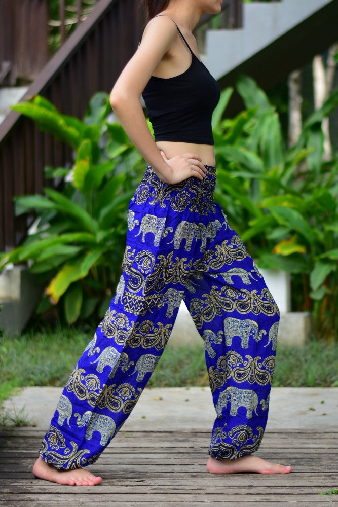 Bohotusk Blue Elephant Grassland Print trousers featuring an elasticated smocked waist, showcasing vibrant colors and a stylish design.