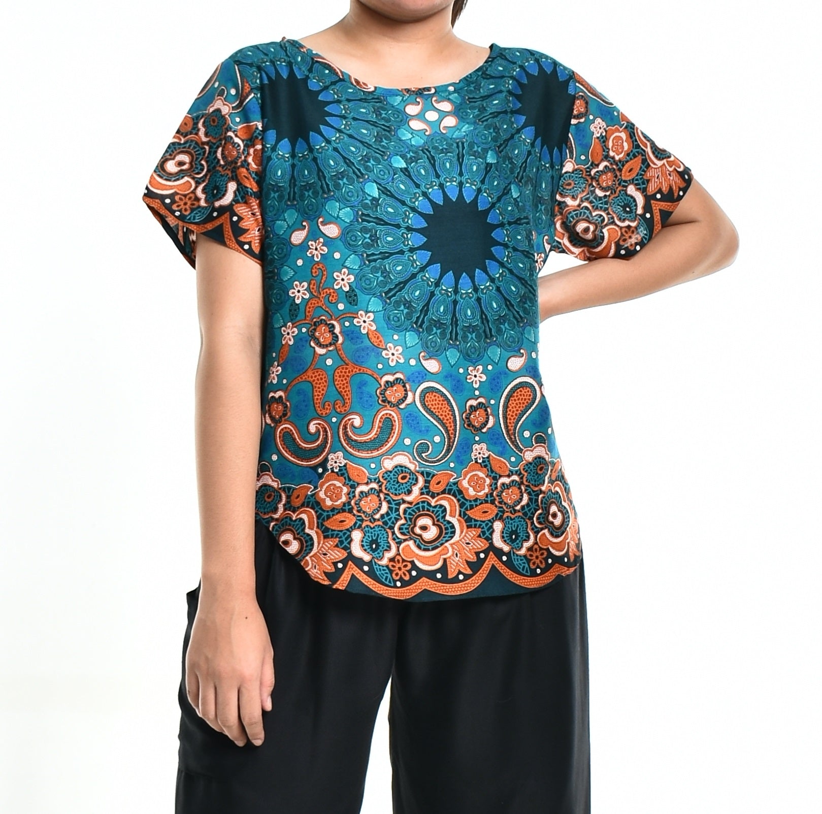 Bohotusk Green Teardrop Splash Print Short Sleeved Top displayed on a mannequin, showcasing its vibrant design and lightweight fabric.