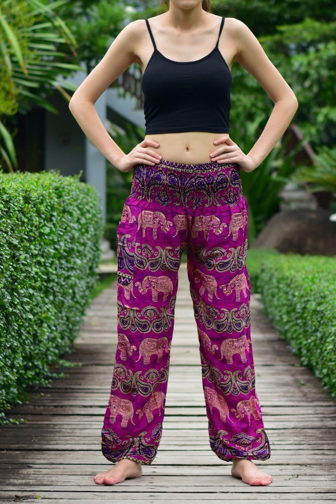 Bohotusk Pink Elephant Grassland Print trousers with elasticated smocked waist, showcasing vibrant colors and a comfortable fit.