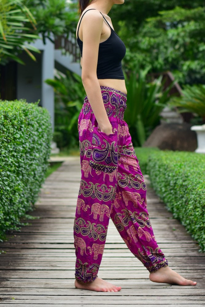 Bohotusk Pink Elephant Grassland Print trousers with elasticated smocked waist, showcasing vibrant colors and a comfortable fit.