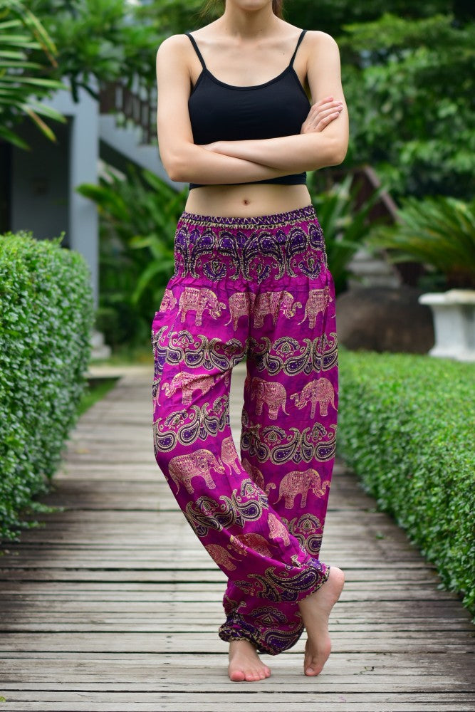 Bohotusk Pink Elephant Grassland Print trousers with elasticated smocked waist, showcasing vibrant colors and a comfortable fit.