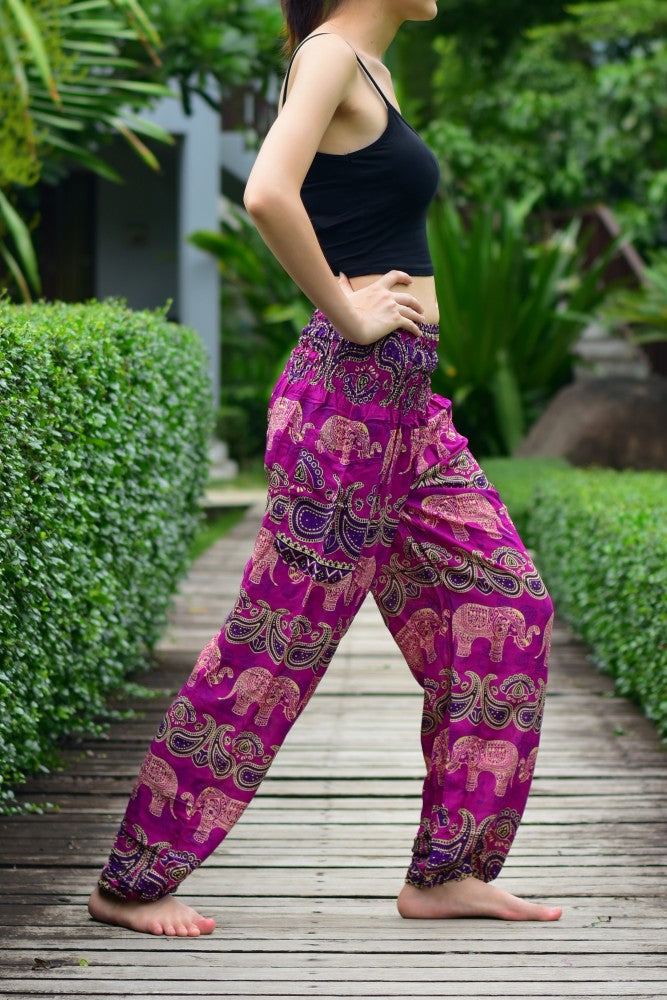 Bohotusk Pink Elephant Grassland Print trousers with elasticated smocked waist, showcasing vibrant colors and a comfortable fit.