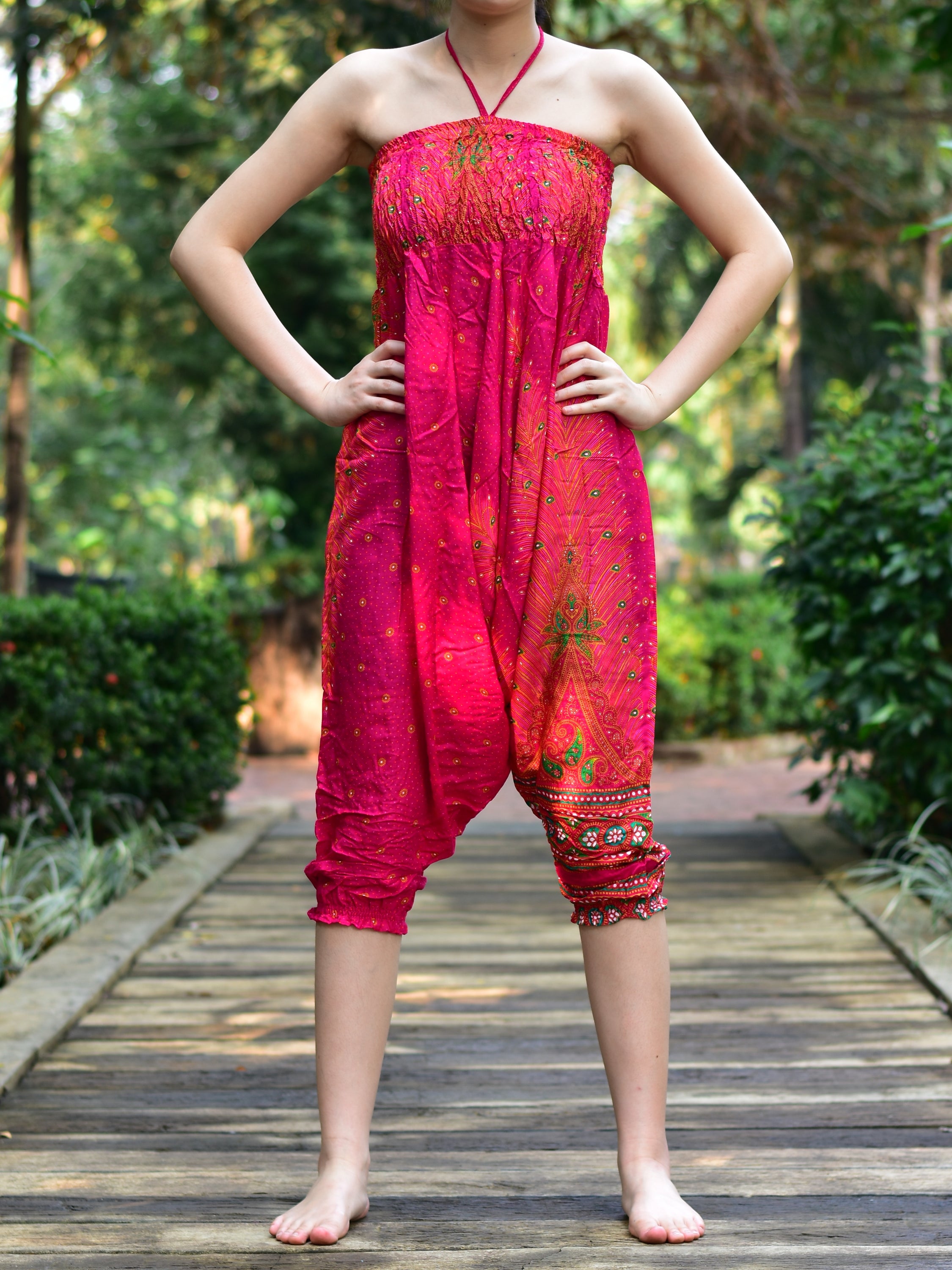 Bohotusk Pink Peacock Print Jumpsuit showcasing vibrant colors and unique design, perfect for versatile styling.