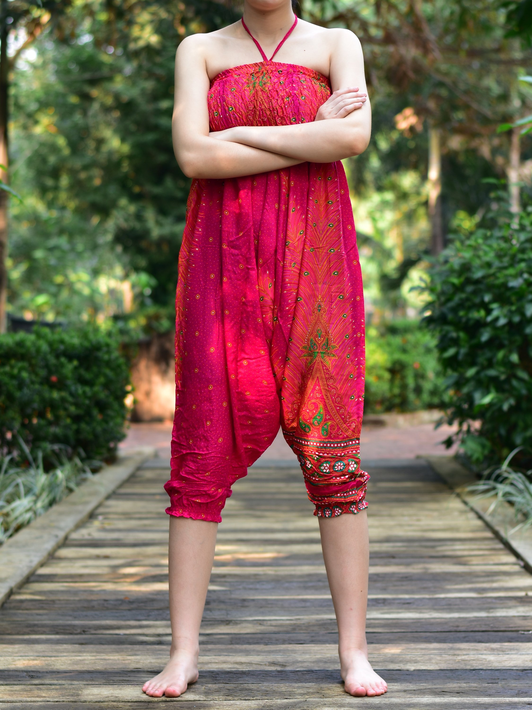 Bohotusk Pink Peacock Print Jumpsuit showcasing vibrant colors and unique design, perfect for versatile styling.