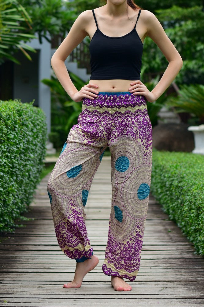 Bohotusk Purple Garden Swirl Print trousers with elasticated smocked waist, showcasing vibrant colors and lightweight fabric.