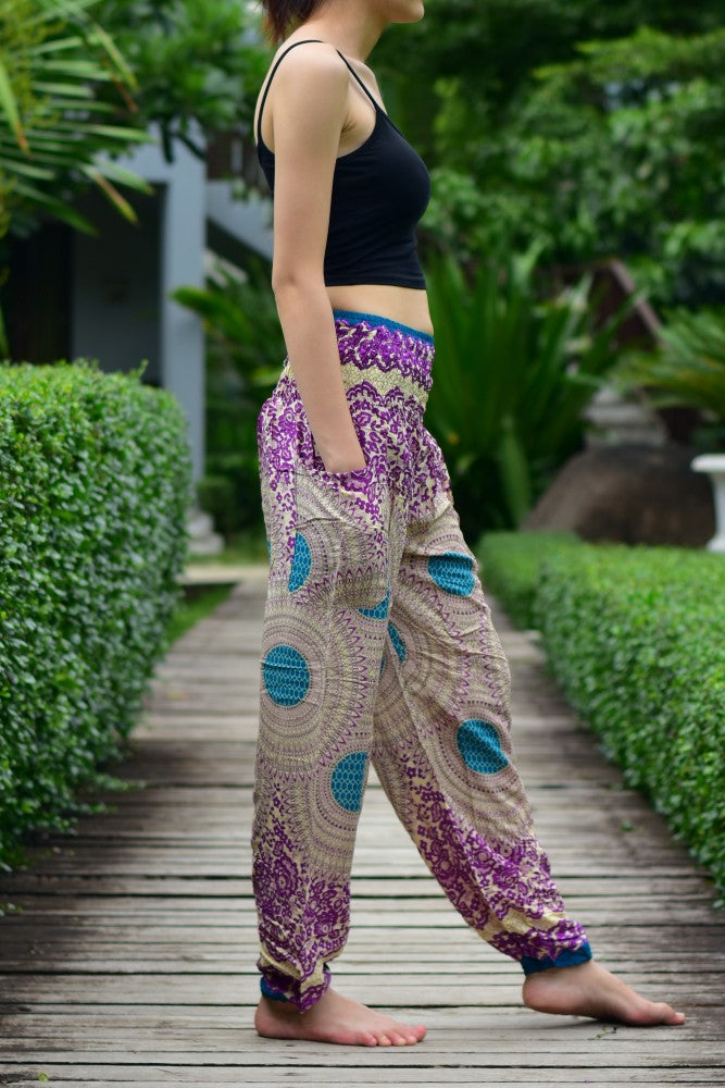 Bohotusk Purple Garden Swirl Print trousers with elasticated smocked waist, showcasing vibrant colors and lightweight fabric.