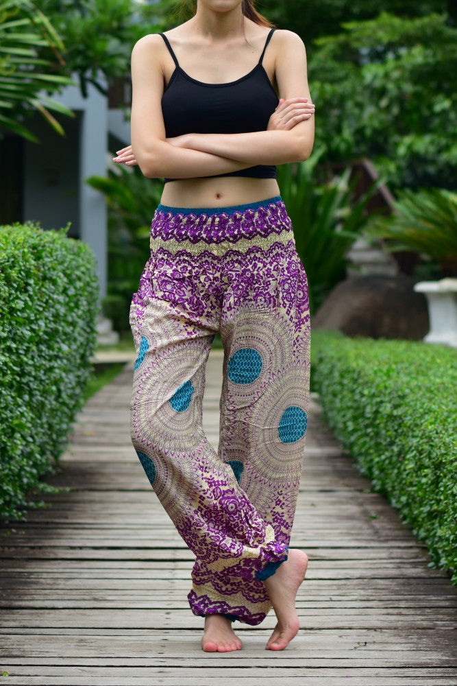 Bohotusk Purple Garden Swirl Print trousers with elasticated smocked waist, showcasing vibrant colors and lightweight fabric.