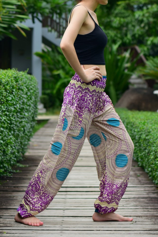 Bohotusk Purple Garden Swirl Print trousers with elasticated smocked waist, showcasing vibrant colors and lightweight fabric.