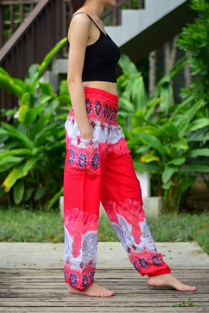 Bohotusk Red Elephant Boro Print trousers with elasticated smocked waist, showcasing vibrant colors and unique design, perfect for casual and active wear.