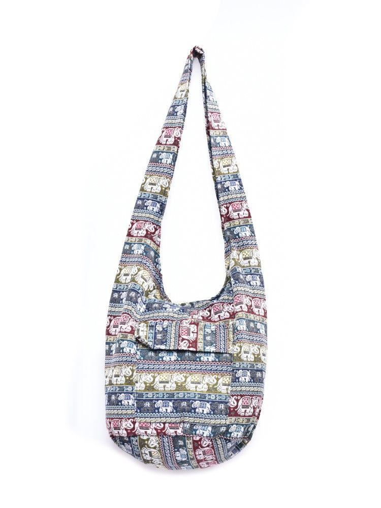 Bohotusk Striped Elephant Multi Stripe Cotton Canvas Sling Shoulder Bag featuring vibrant stripes and spacious design.