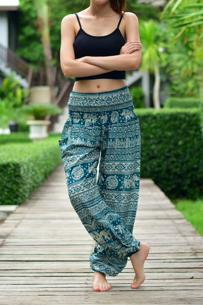 Bohotusk Turquoise Elephant Calf Print trousers with elasticated smocked waist, showcasing vibrant colors and unique design.