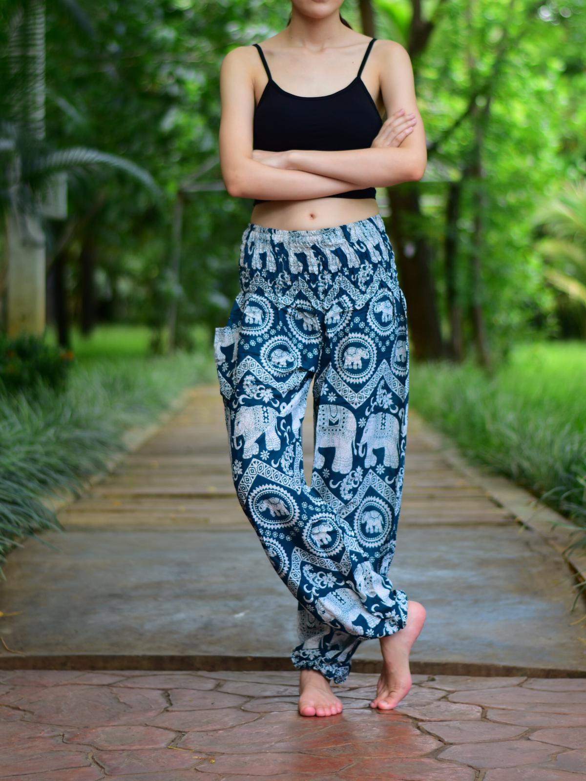 Person wearing printed pants outdoors.