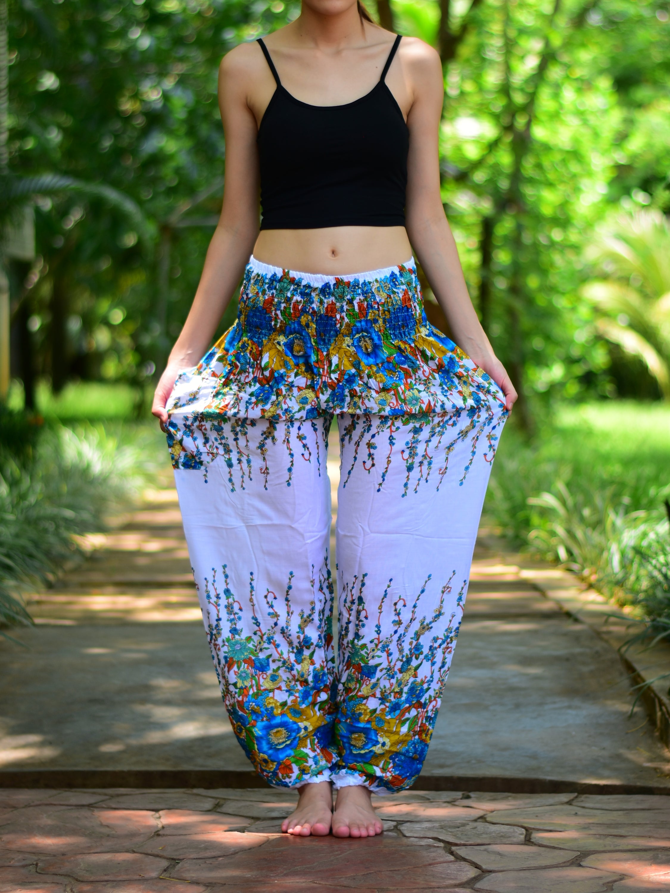 Bohotusk White Floral Print Elasticated Smocked Waist Womens Harem pants displayed on a model, showcasing the floral design and elasticated waist.