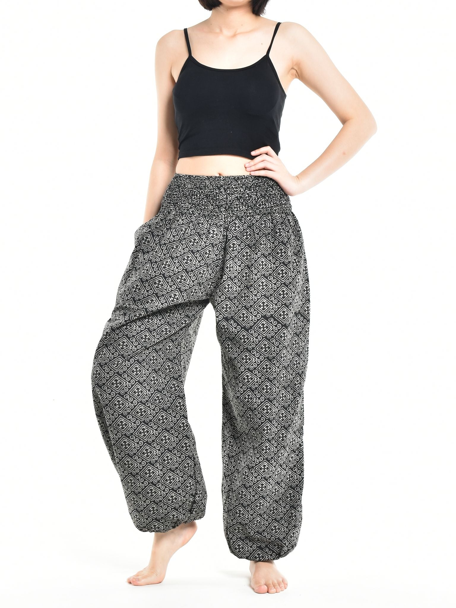 Bohotusk Women's Autumn Black Zig Zag Cotton Harem Pants displayed on a mannequin, showcasing the elasticated waist and ankle design.