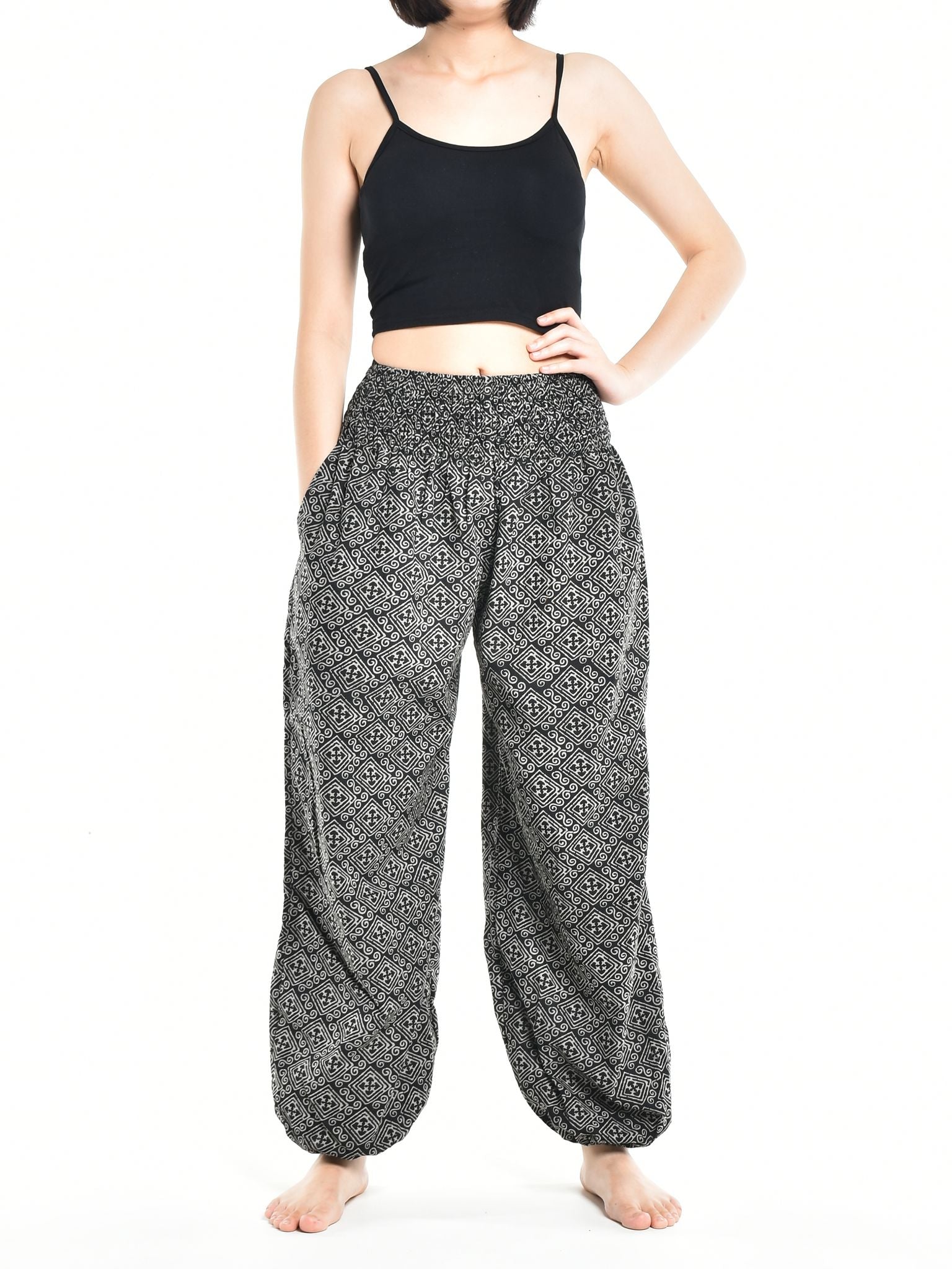 Bohotusk Women's Autumn Black Zig Zag Cotton Harem Pants displayed on a mannequin, showcasing the elasticated waist and ankle design.