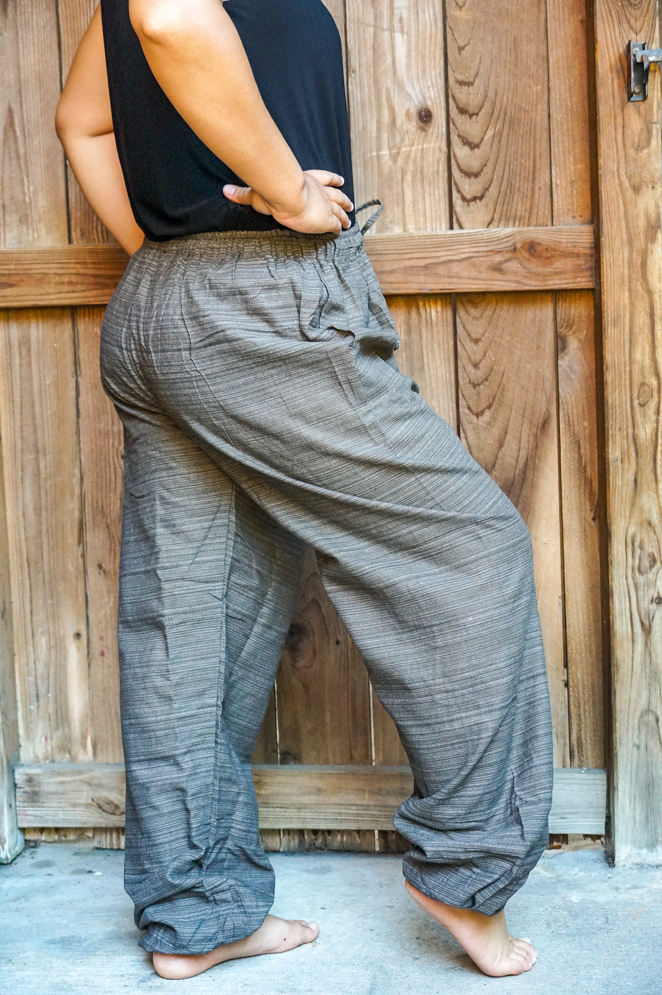 A pair of stylish Cotton Boho Hippie Gypsy Pants in soft cotton, featuring an elastic drawstring waist and two side pockets, perfect for casual wear.