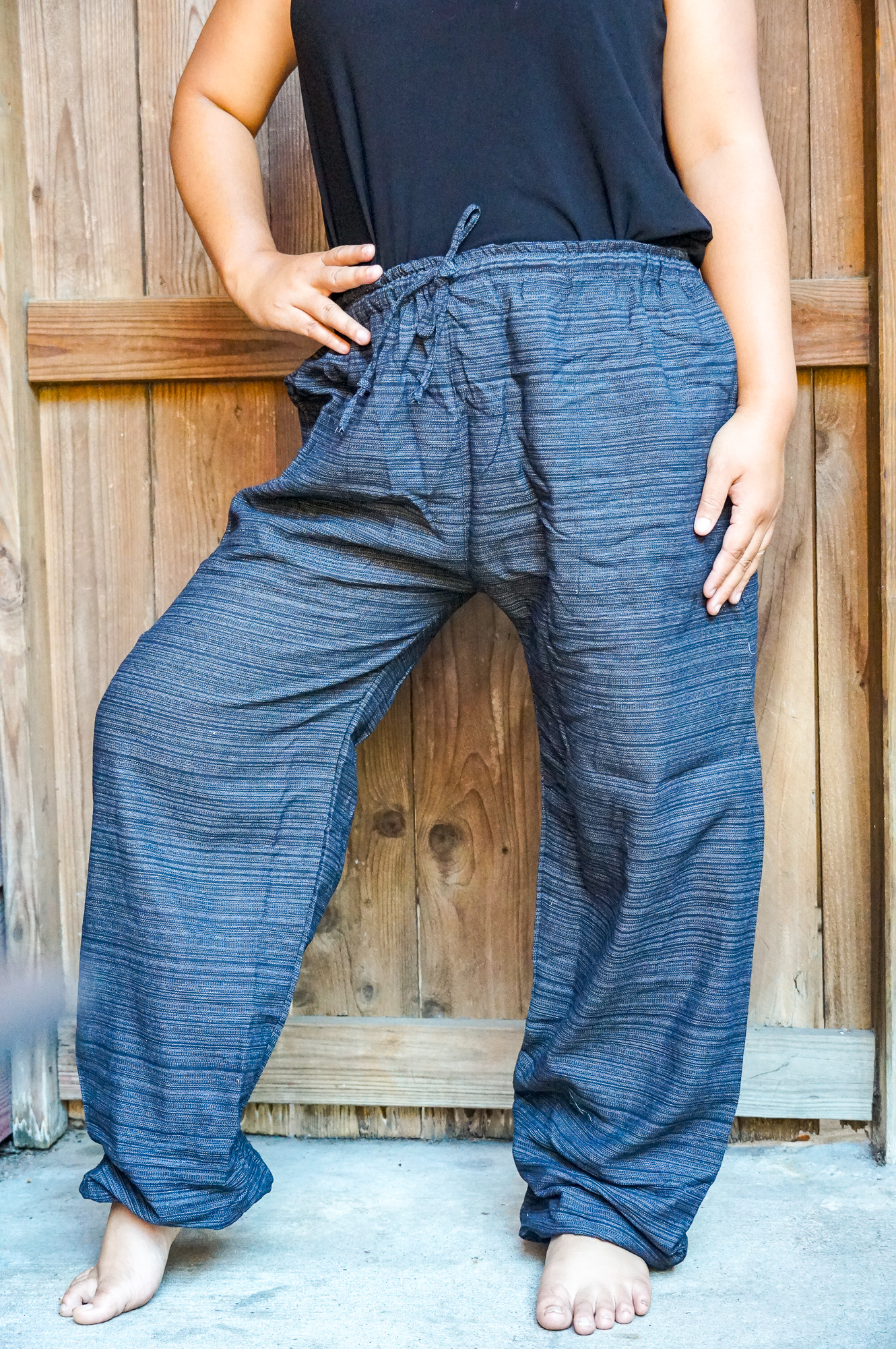 A pair of stylish Cotton Boho Hippie Gypsy Pants in soft cotton fabric, featuring an elastic drawstring waist and ankle cuffs, perfect for casual wear.