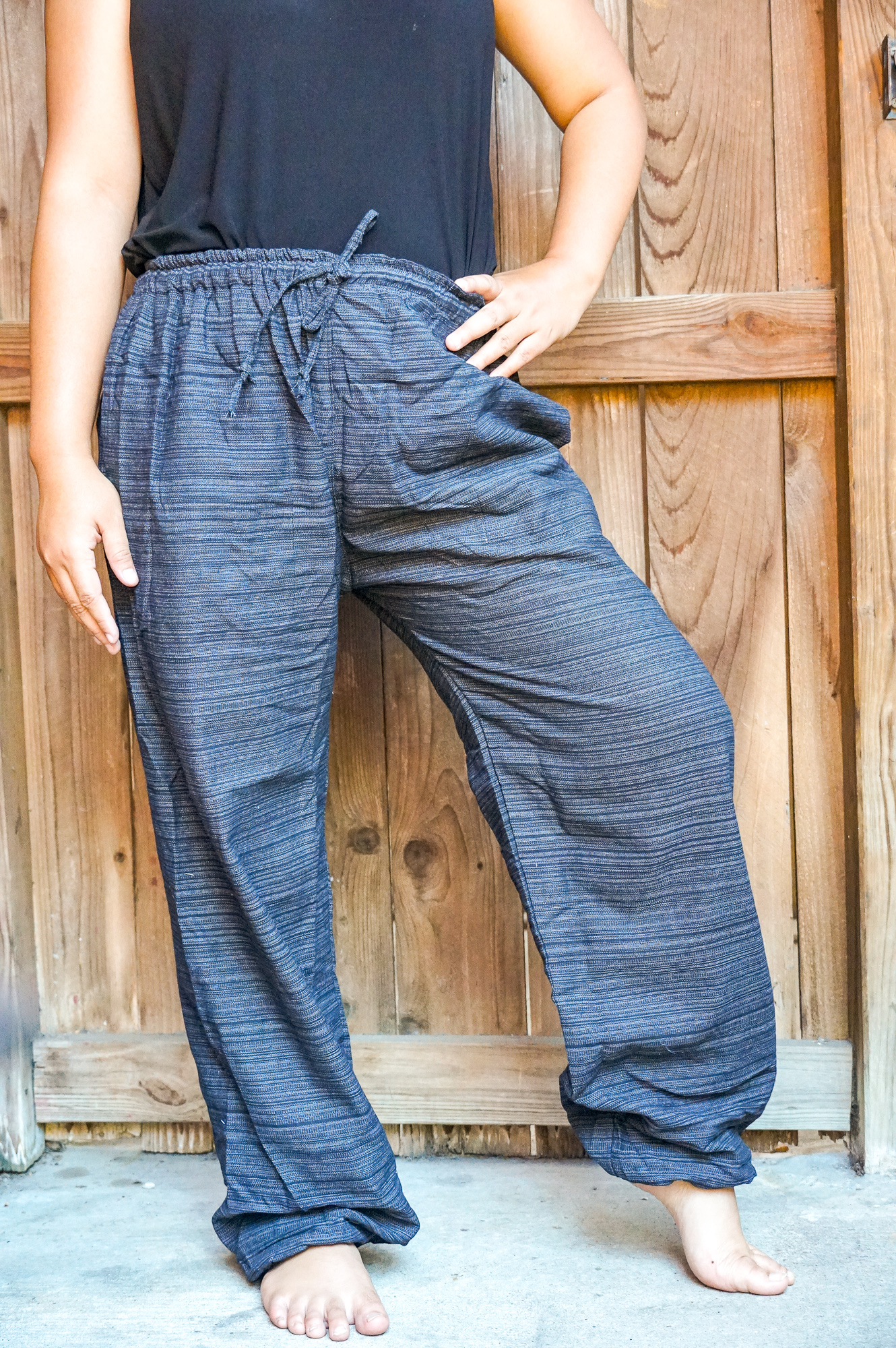 A pair of stylish Cotton Boho Hippie Gypsy Pants in soft cotton fabric, featuring an elastic drawstring waist and ankle cuffs, perfect for casual wear.