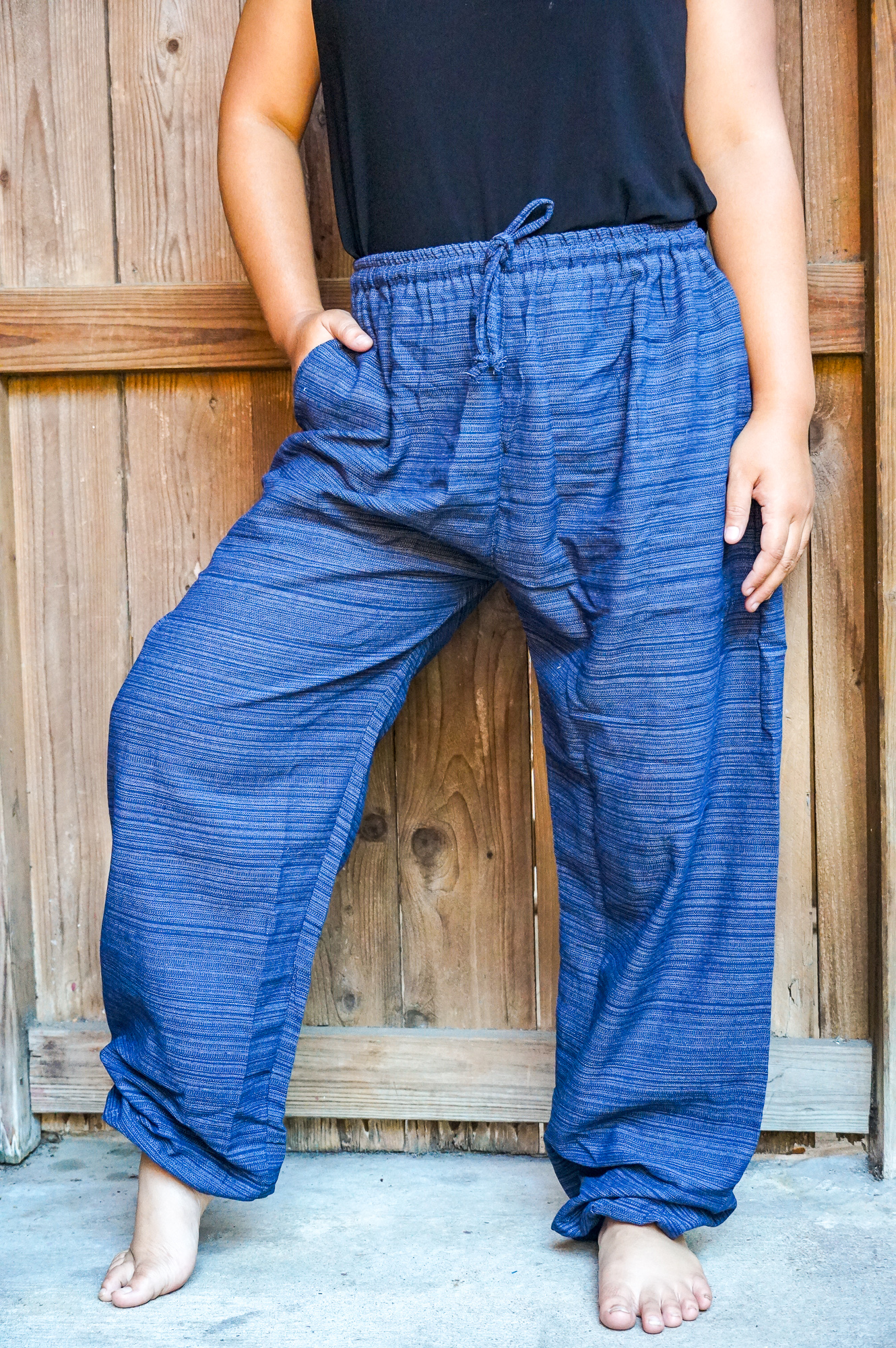 A pair of stylish Cotton Boho Hippie Gypsy Pants in soft cotton, featuring an elastic drawstring waist and two side pockets, perfect for casual wear.