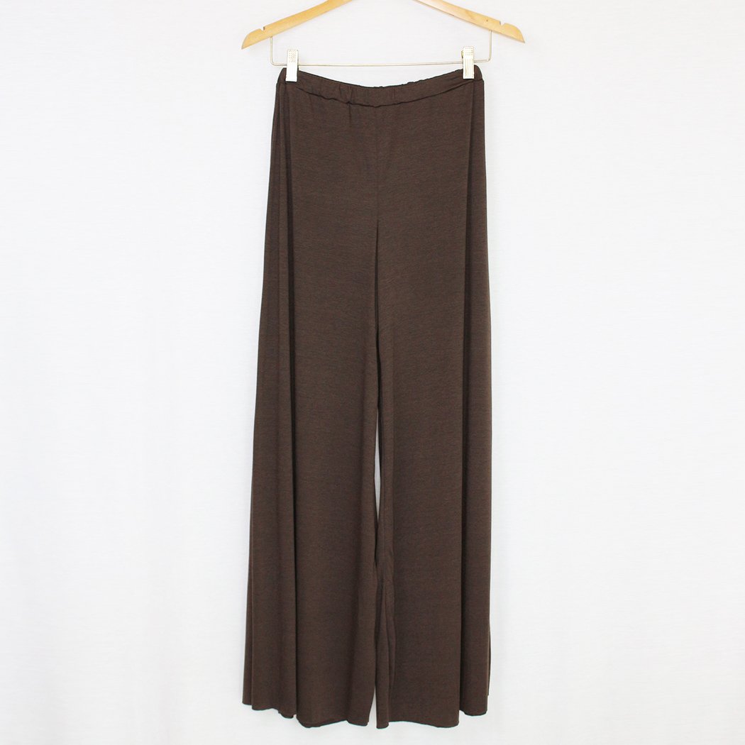 Brown elastic waist wide leg pants displayed on a hanger, showcasing their stylish design and comfortable fit.